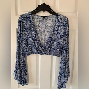 Long flowy sleeve low cut neck line blouse